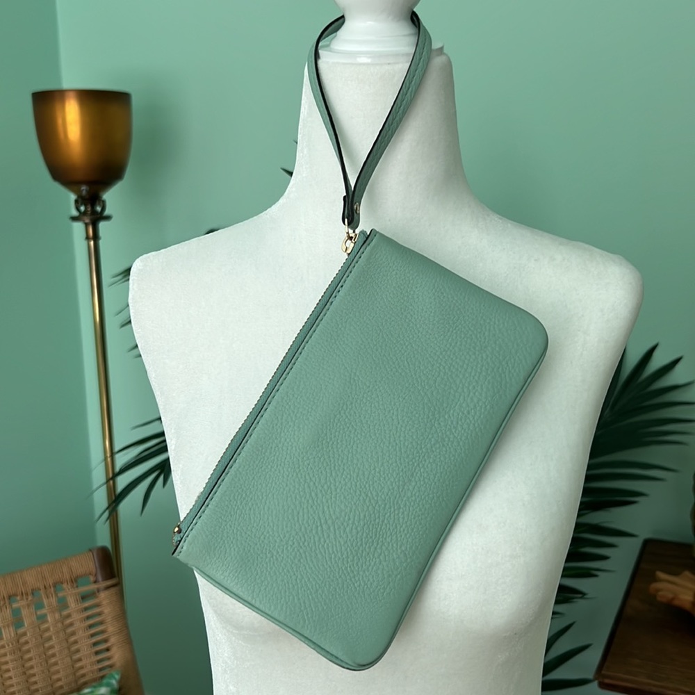 Bright and fun greenish blue Kate Spade wristlet